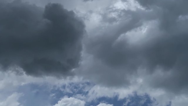 Dramatic clouds sky  before thunder storm TimeLapse. Abstract nature background of beautiful white & dark rain cloudscape moving by wind in rainy season in tropical summer sky, overcast weather, space