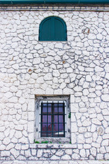 Fototapeta na wymiar Corfu island historical heritage, architecture, cosy streets, houses, buildings, doors, windows, vegetation, Greece, summer