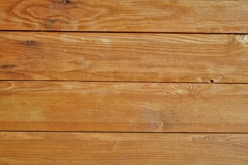 Obraz na płótnie Canvas texture of wood planks coated with glaze. color similar to chestnut, teak, walnut or oak. May be suitable for advertising protective wood coatings