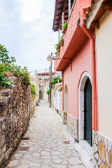 Corfu island historical heritage, architecture, cosy streets, houses, buildings, doors, windows, vegetation, Greece, summer