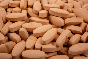 Drugs, painkillers, colds and other medicines. orange pills lie on table