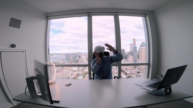 Caucasian employee in VR headset creating BTL communications and direct sales for using in various businesses to demonstrate product at contemporary exhibitions, concept of visual simulation
