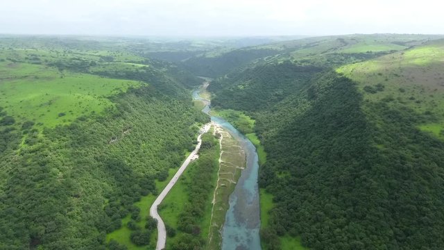 A surprising snapshot of the drone in the fall in Salalah, Ain Darbat, Sultanate of Oman 