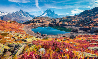 Exciting autumn view of Cheserys lake (Lac De Cheserys), Chamonix location. Superb morning scene of Vallon de Berard Nature Preserve, Graian Alps, France, Europe.