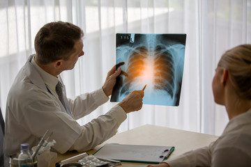doctor and patient looking at x ray image