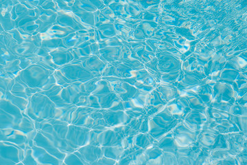 Blue water ripple reflection in the swimming pool