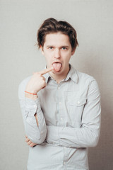 young man with finger in mouth