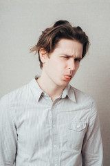 Adult man with bad manners - showing his tongue