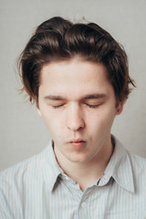 Man sucking in his cheeks