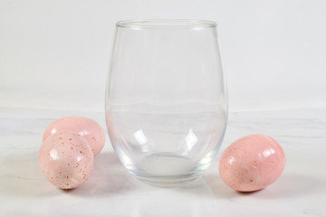 Easter inpired stemless wine glass mockup with colorful eggs