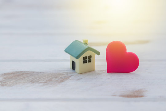 House with a red heart on white wooden