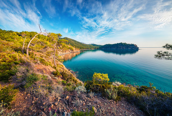 Naklejka premium Spectacular summer view of a small azure bay near Tekirova village, District of Kemer, Antalya Province. Scenic Mediterranean seascape in Turkey. Beauty of nature concept background.