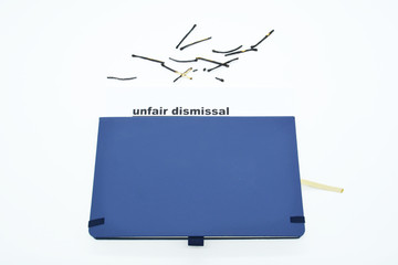 unfair dismissal papers on the workplace