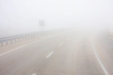 Mystical road in white fog stretching into the distance - Powered by Adobe