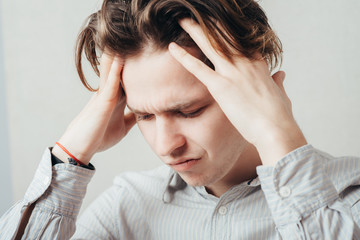 Man holding his hands over his ears