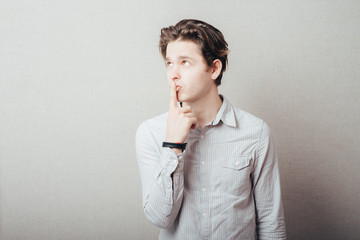 man pointing up with his index finger