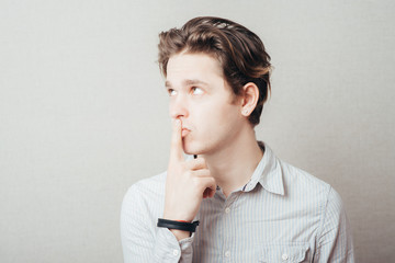 man pointing up with his index finger