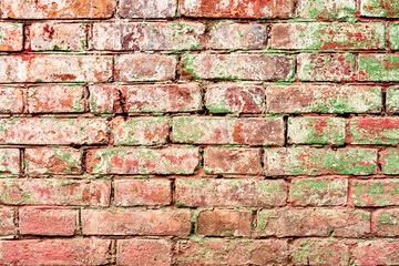 Texture of a brick wall with cracks and scratches which can be used as a background