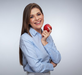 Smiling woman holding red apple.