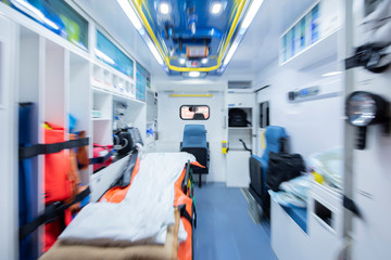 Ambulance interior with emergency equipment, stretcher and transfer chair. Emergency concept. Zoom photo