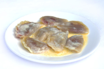 Boiled Dumplings with Cherry in Butter, dishes of Russian national cuisine