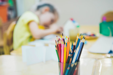 Colored pencils in a jar. Kid Creativity Education Concept.