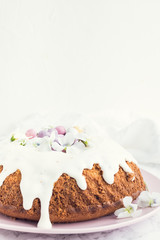 Glazed easter cake with flowers and candy