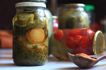 jars of pickles tomatoes and cucumbers