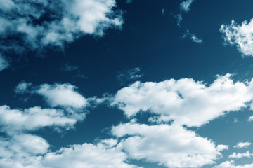 Sky with clouds toning in blue. Natural background concept