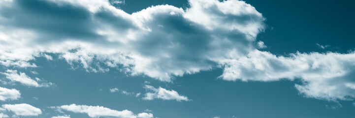 Sky with clouds toning in red. Panoramic image.