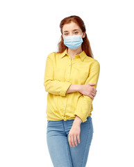 health, quarantine and pandemic concept - young woman wearing protective medical mask for protection from virus disease over grey background