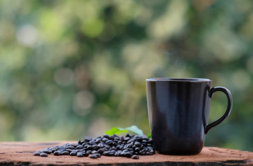 cup of coffee on wood counter background and space for text