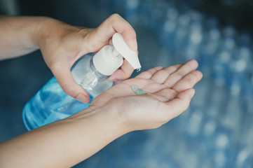 Business woman working from home in quarantine for coronavirus or covid-19, Cleaning hands with sanitizer gel.