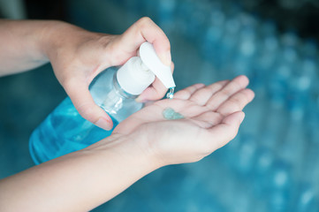 Business woman working from home in quarantine for coronavirus or covid-19, Cleaning hands with sanitizer gel.