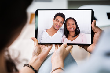 Young Couple Using Digital Tablet Together