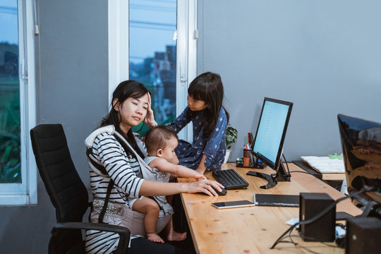 Stress Mother While Working From Home And Babysitting Her Children