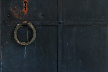 Close-up of the old iron black door