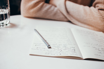writer notebook with words and pen