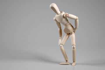 Wooden Mannequin on gray background