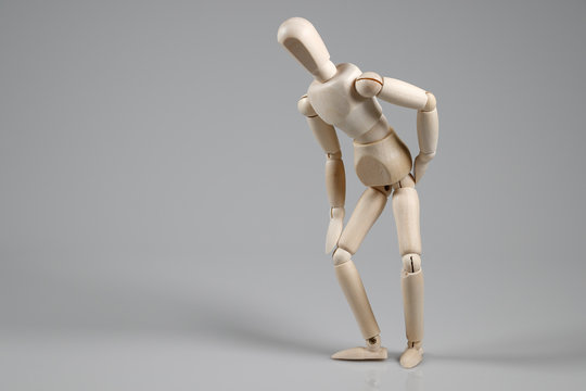 Wooden Mannequin on gray background