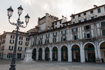 Fototapeta premium Arcades and clock tower in Piazza della Loggia, Brescia, Lombardy, Italy.