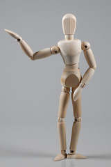 Wooden Mannequin on gray background