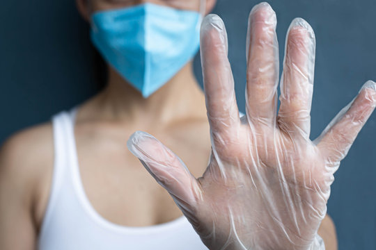 Woman Wearing A N95 Mask And Latex Gloves; Coronavirus Outbreak Protection