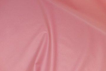 Pink paper wrinkled texture background or backdrop