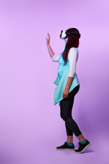 Woman is using virtual reality headset.