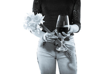 black and white photo, girl with a glass of wine and a bouquet of daffodils in hand