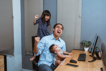 stress young man working from home and being disturbed by his children