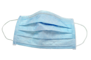 Used green 3 ply disposable surgical mask isolated on gray background, with clipping path