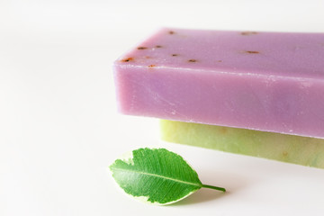Lavander on green tea shampoo and body soap bar blocks and fresh leaf on white background. Health care, body care and hygiene product