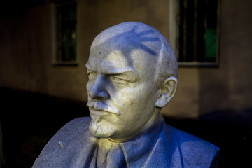 Bust of Lenin with a shadow by hand on his head